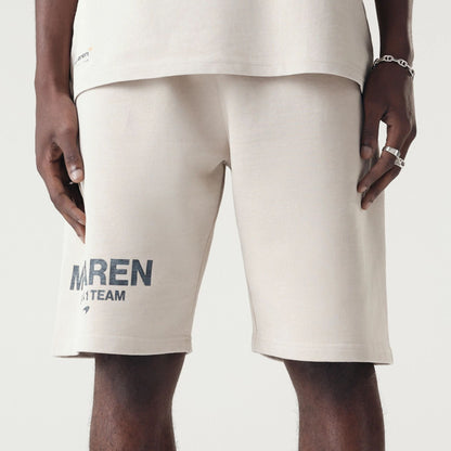 The Male model is wearing McLaren Racing Washed Pack Cream Oversized Shorts 3