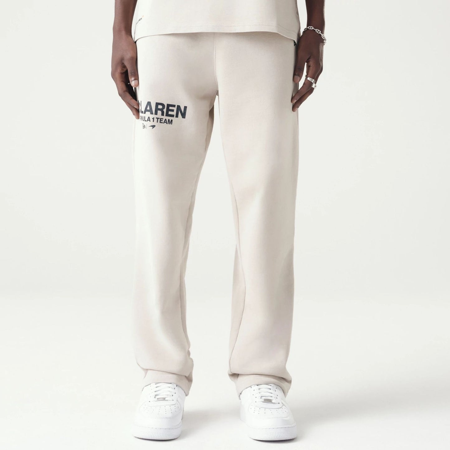 The Male model is wearing McLaren Racing Washed Pack Cream Straight Leg Joggers 1