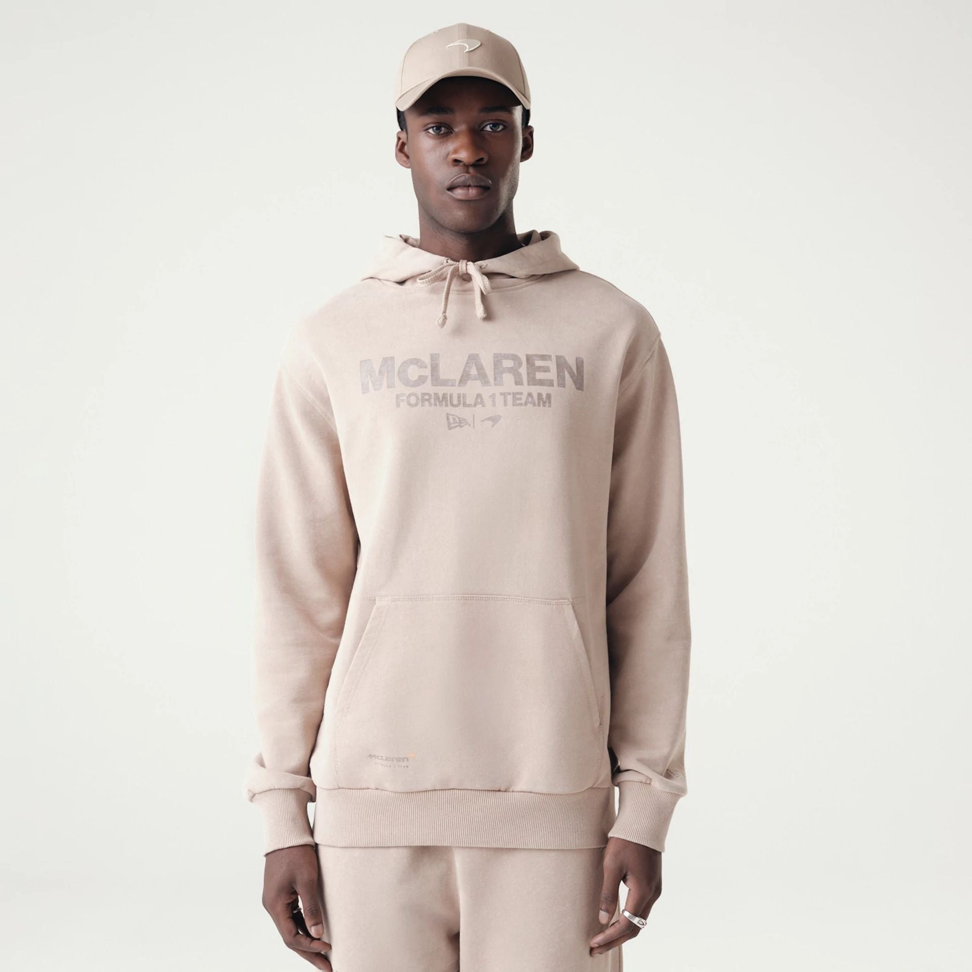 The Male model is wearing McLaren Racing Washed Pack Beige Oversized Hoodie 1