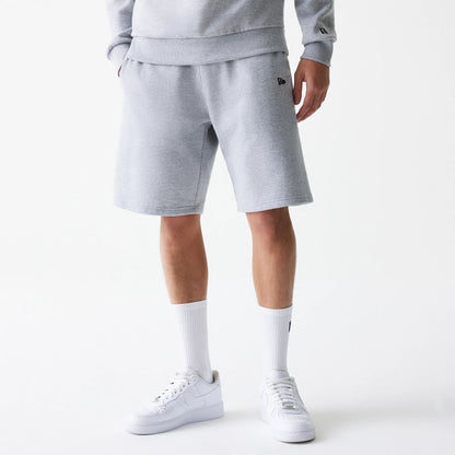 The Male model is wearing New Era Grey Oversized One Panel Shorts 6