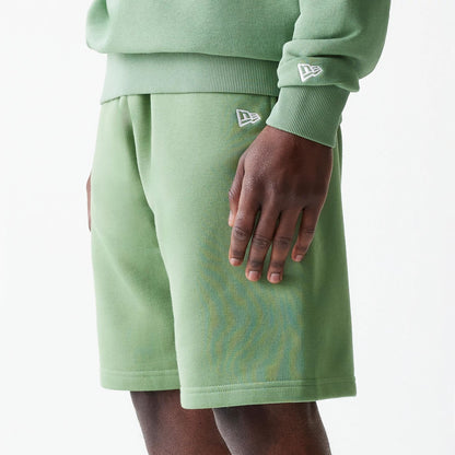 The Male model is wearing New Era Green Oversized One Panel Shorts 3