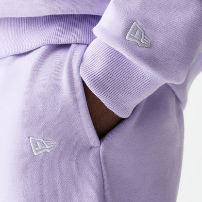 The Male model is wearing New Era Pastel Purple Oversized One Panel Shorts 3