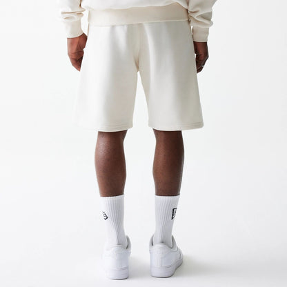 The Male model is wearing New Era Open White Oversized One Panel Shorts 2