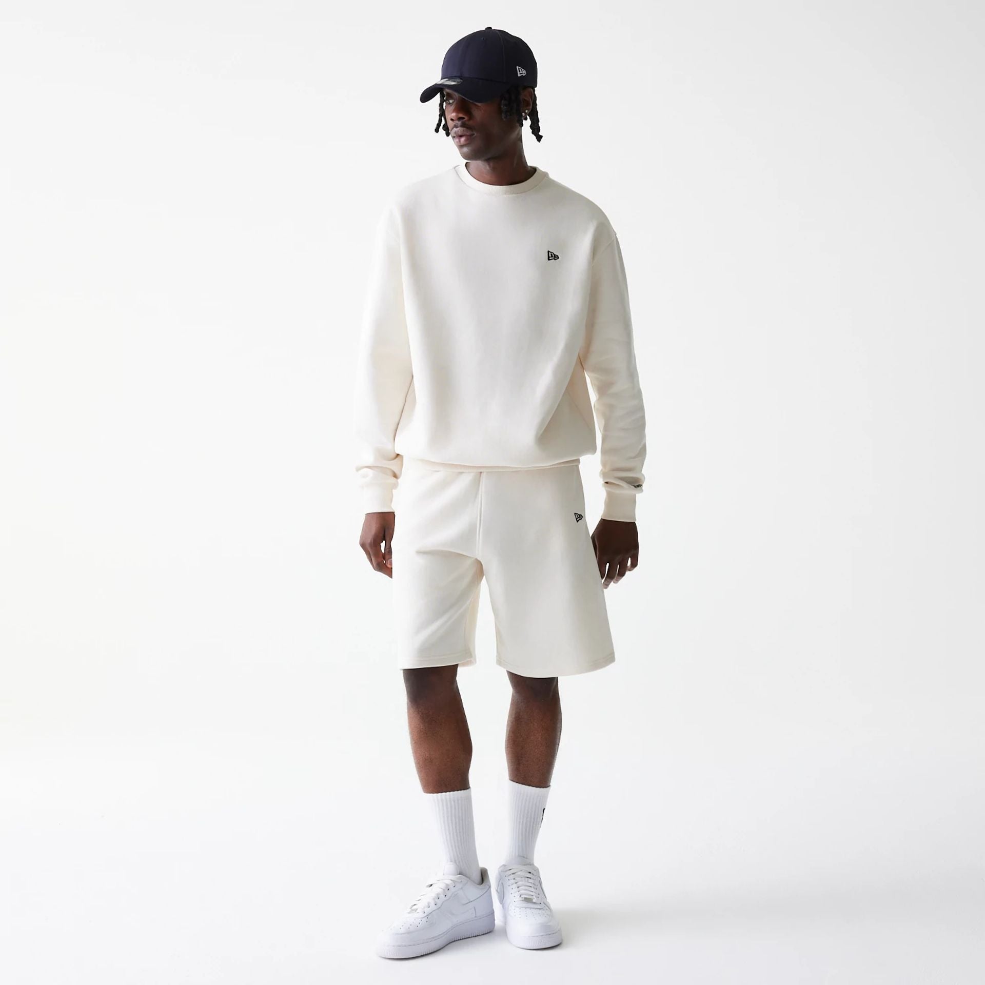 The Male model is wearing New Era Open White Oversized One Panel Shorts 8