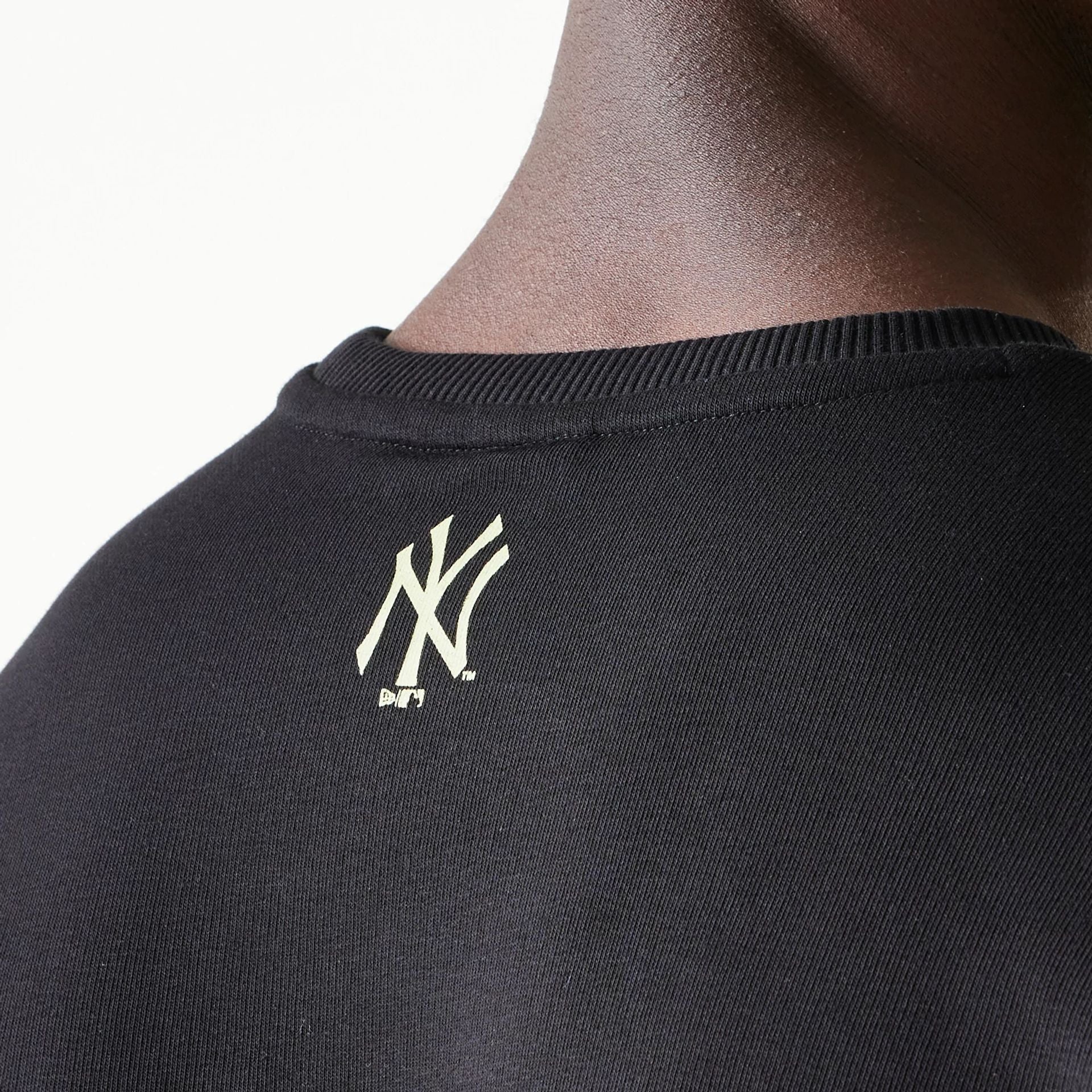 The Male model is wearing New York Yankees MLB Glow Black Crewneck Sweater 7