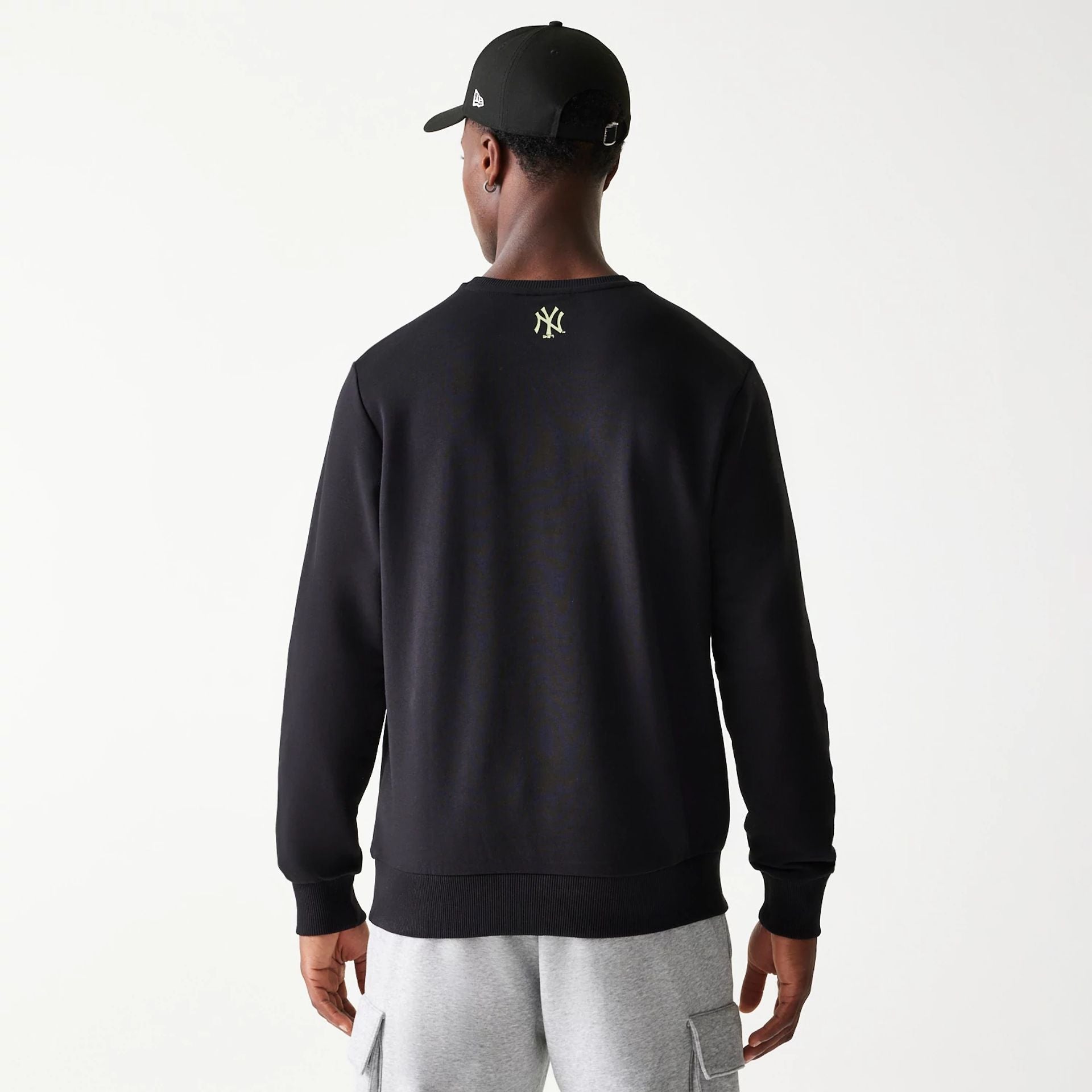 The Male model is wearing New York Yankees MLB Glow Black Crewneck Sweater 3