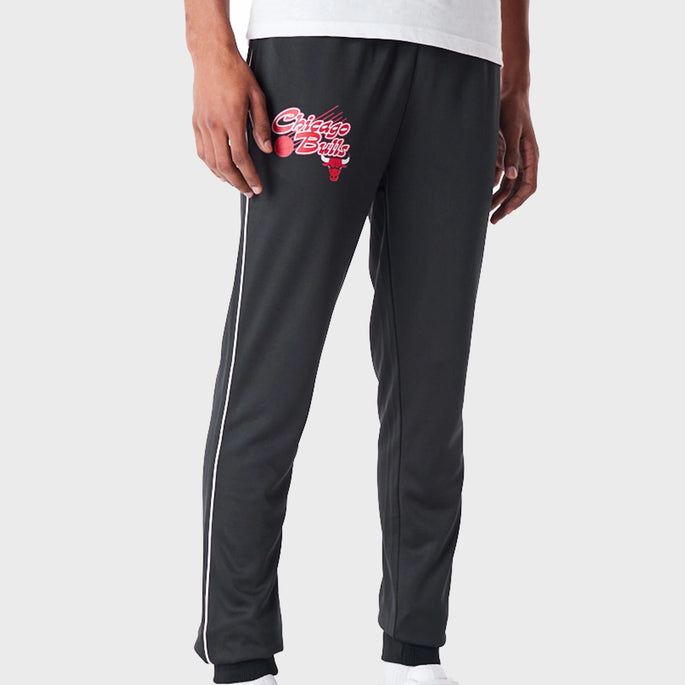 man wearing black chicago bulls joggers