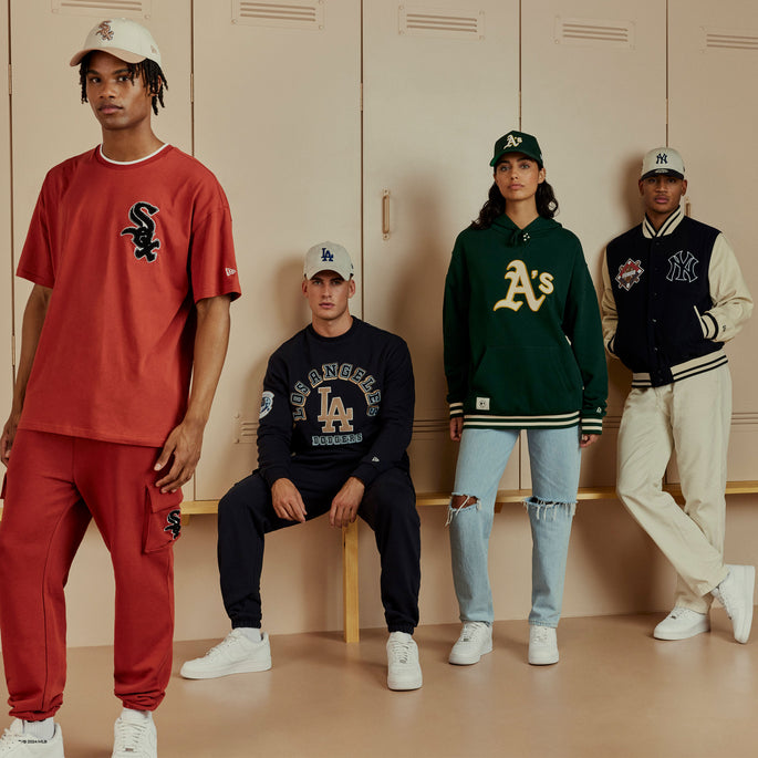 group of young adults wearing mlb clothing 