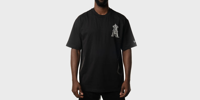 man wearing a black anaheim angels t-shirt