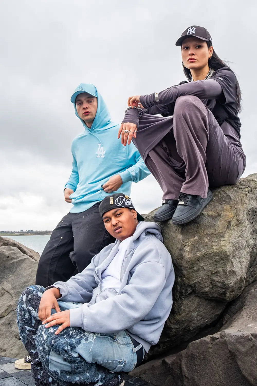 two males and one female wearing new era headwear and clothing for new era x icelandic rap collaboration