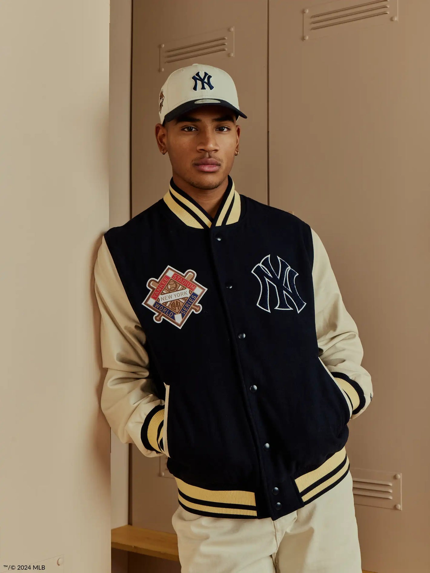 male model wearing ny yankees varsity jacket