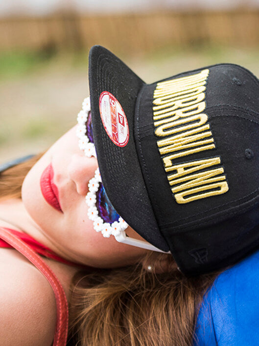 close up of woman wearing a black tomorrowland 59FIFTY cap