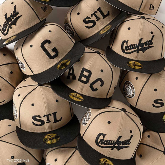 a collection of negro league caps in beige and black