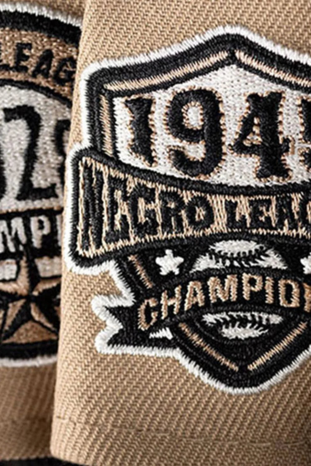 Close-up of side patches on caps from the Negro League collection.