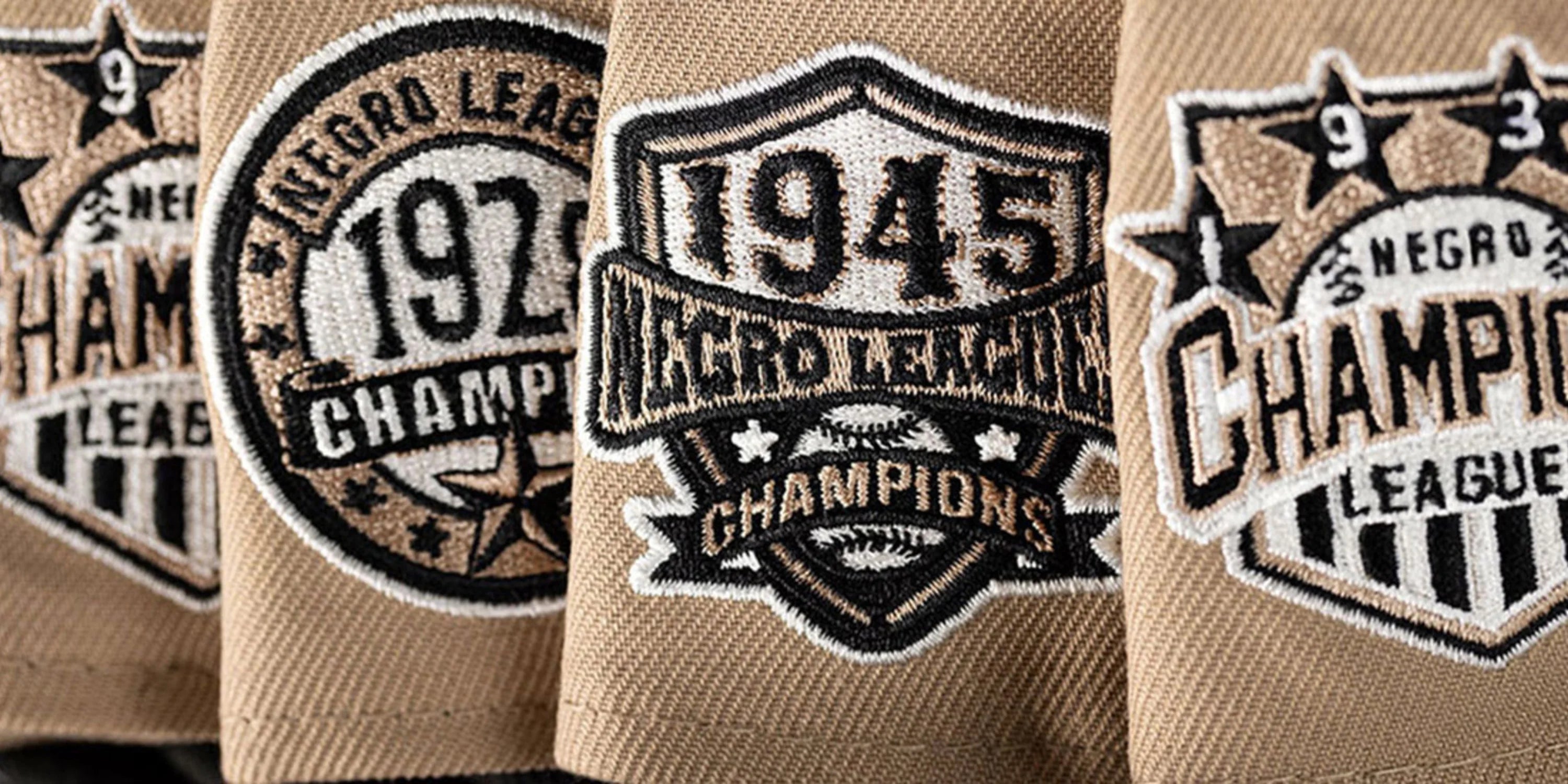 Close-up of side patches on caps from the Negro League collection.