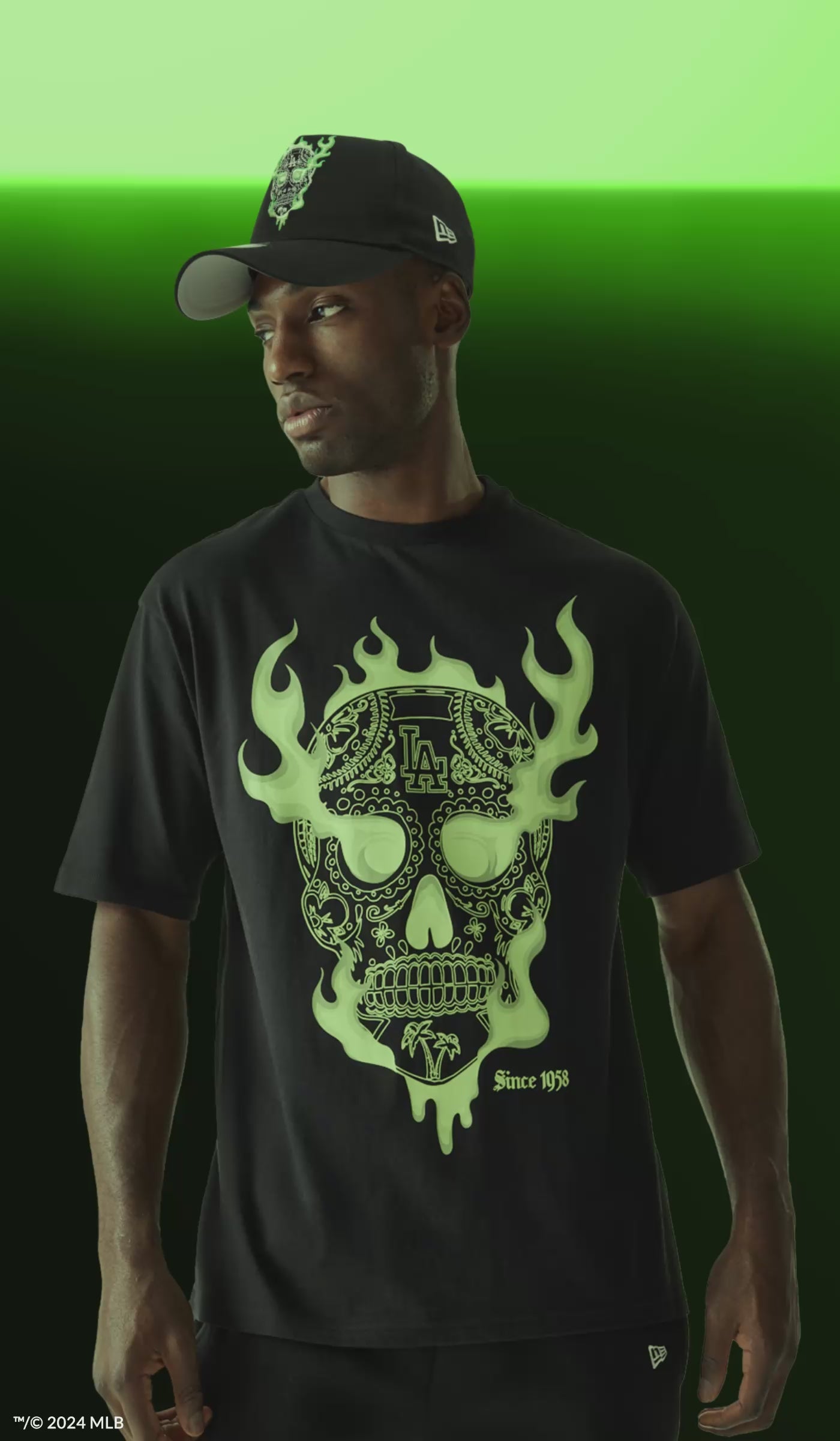 Black t-shirt with green glow in the dark skull.