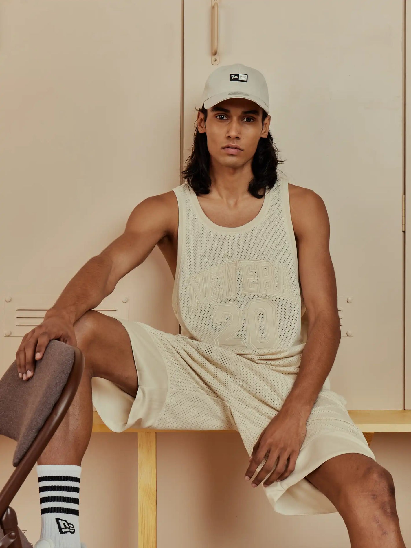 male model wearing new era tank top and shorts 