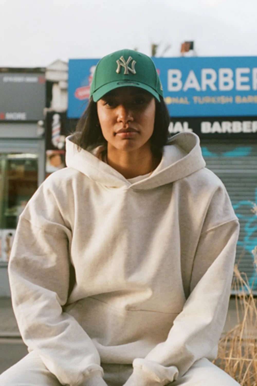 jessica hunter wearing a green new york yankees cap