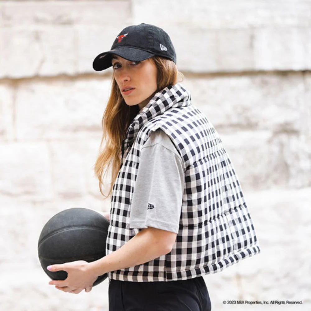 Mariella Santucci wearing a grey new era top and black bulls cap