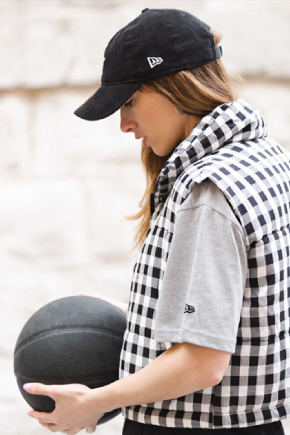 Mariella Santucci wearing a grey new era top and black cap