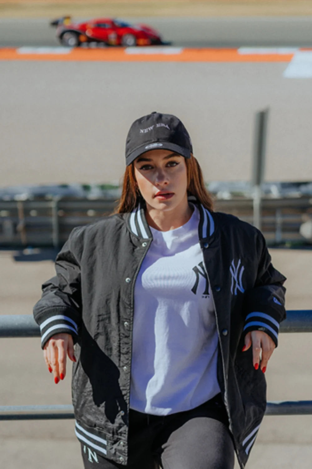 marta garcia wearing a new york yankees top and bomber jacket with a new era black cap