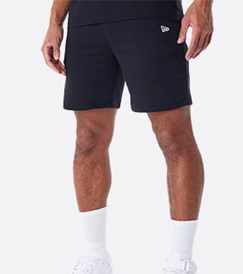 black shorts with new era logo on the right hip of model
