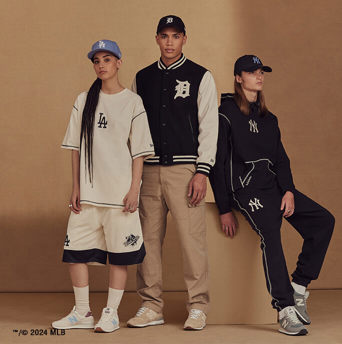 three models wearing new era mlb world series clothing collection